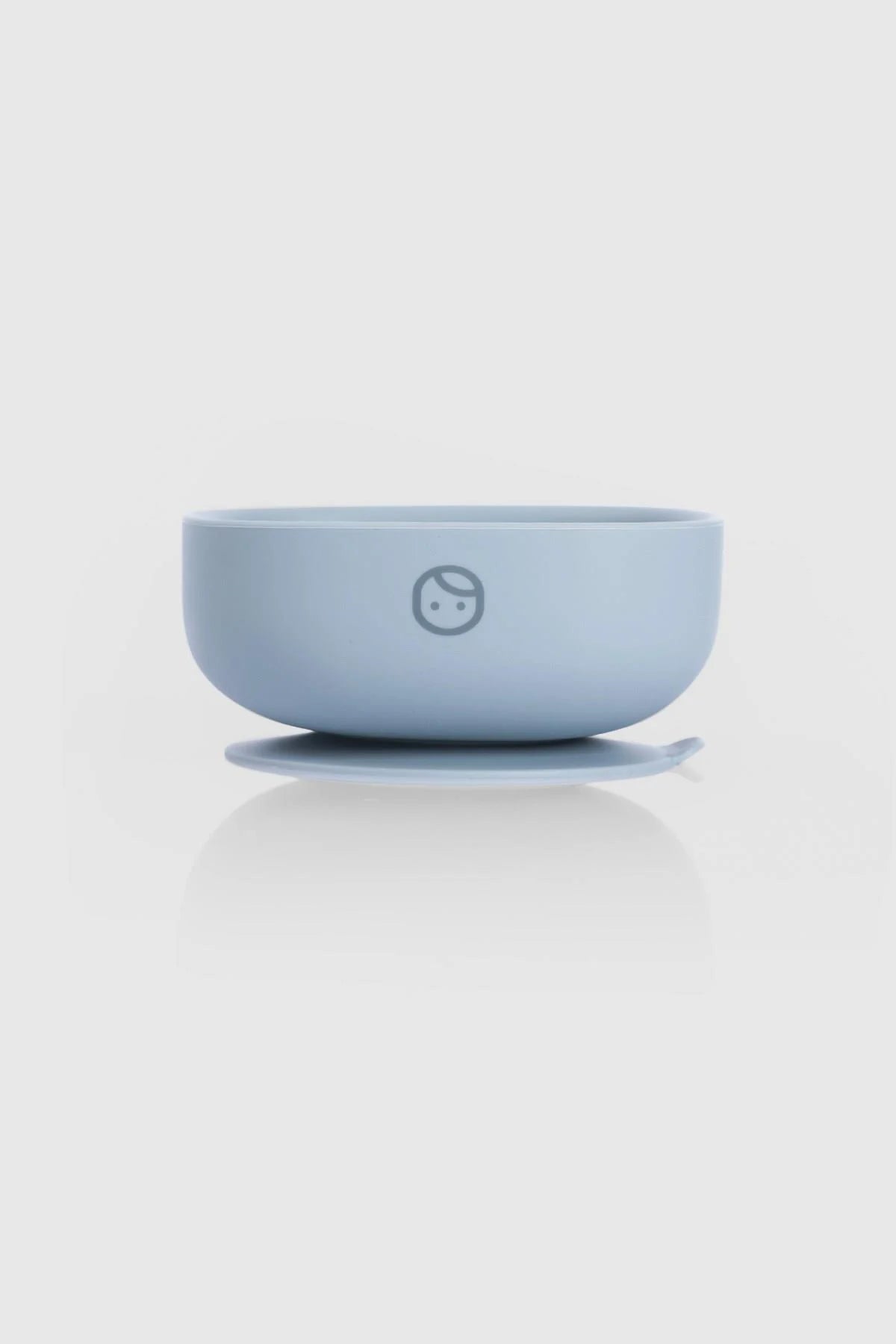 Silicone vacuum food plate in blue, featuring a secure base for minimal spills and easy self-feeding for babies.