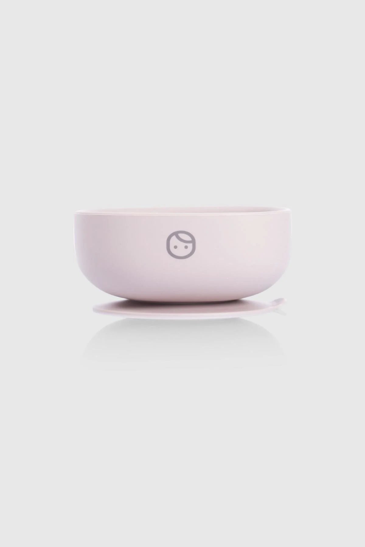 Pink silicone vacuum food plate with a cute logo, designed for easy self-feeding and minimizing spills.