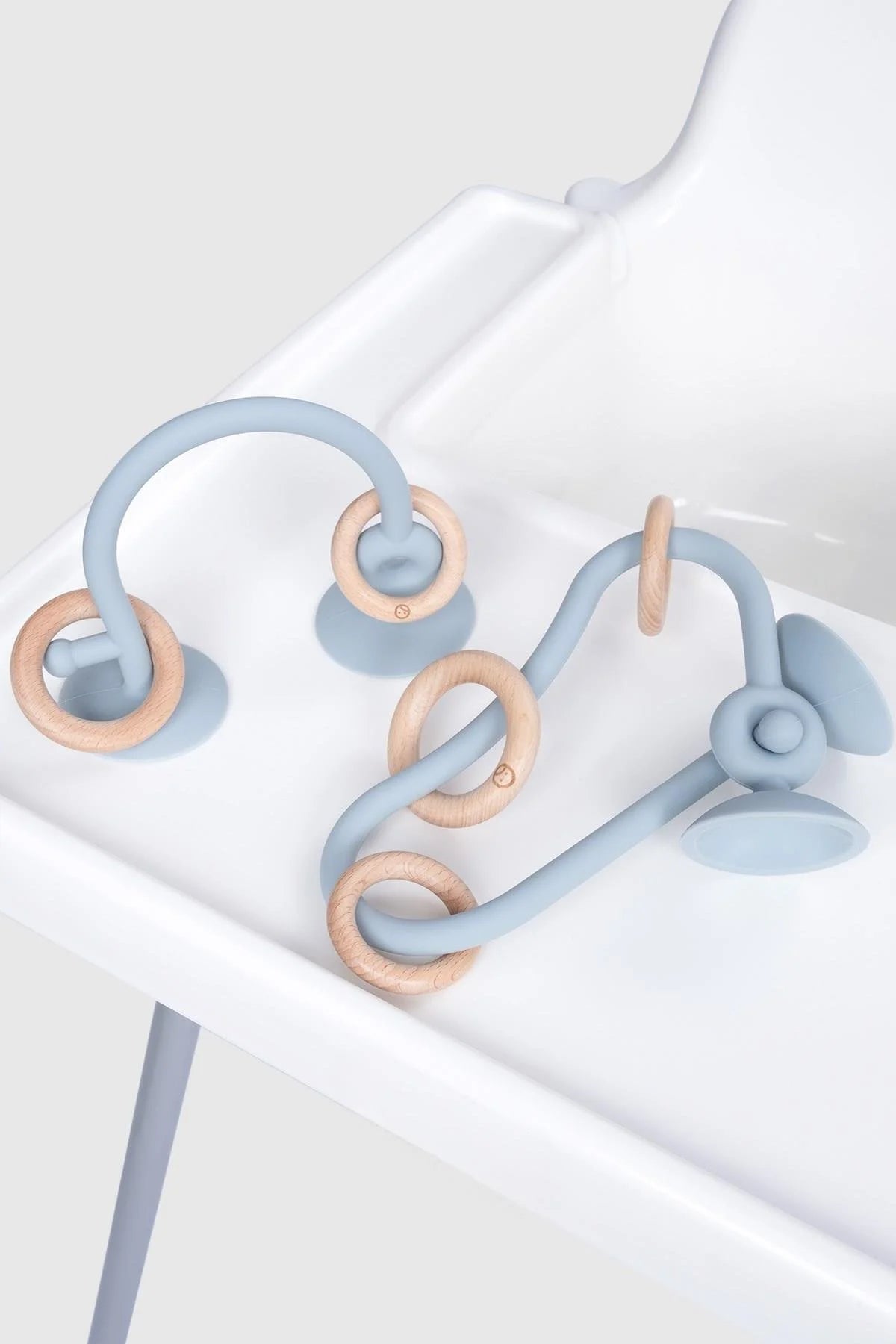 Silicone educational high chair toy set in blue with bamboo accents, designed for baby and toddler playtime.