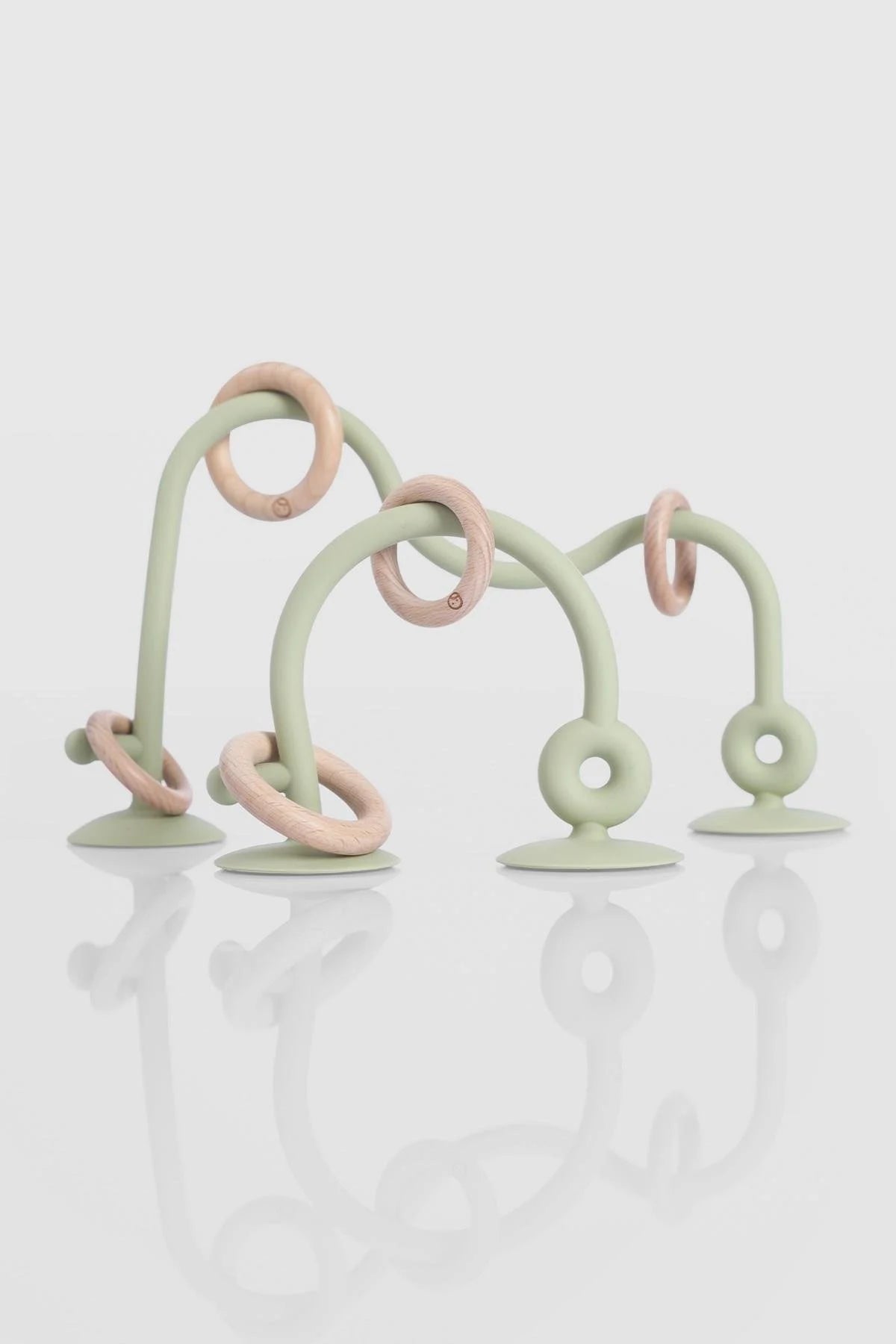 Silicone educational high chair toy in green with wooden rings, perfect for toddlers and babies to enhance learning through play.