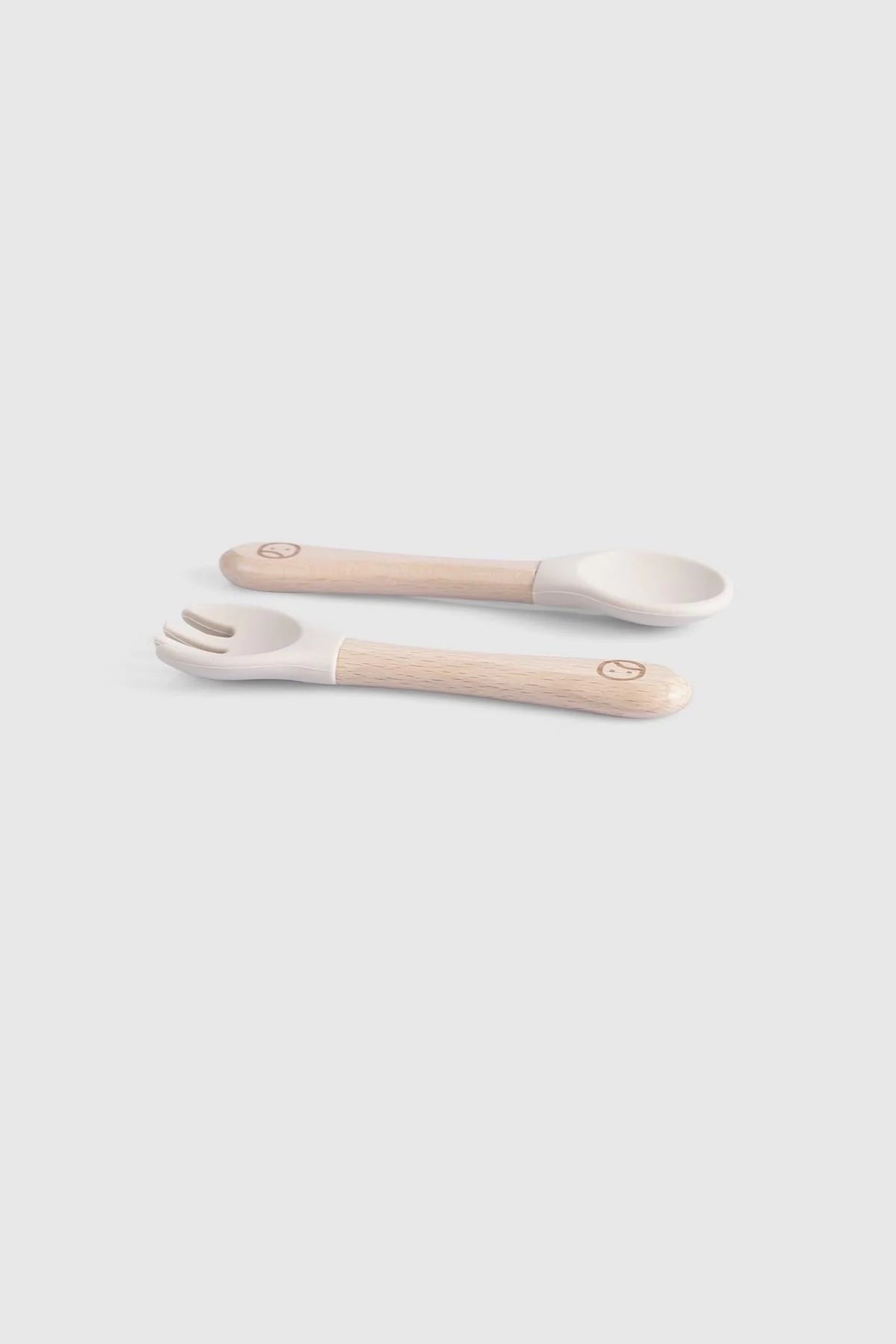 Baby cutlery set with bamboo handles and silicone tips for newborn feeding, BPA-free, Montessori-inspired design.