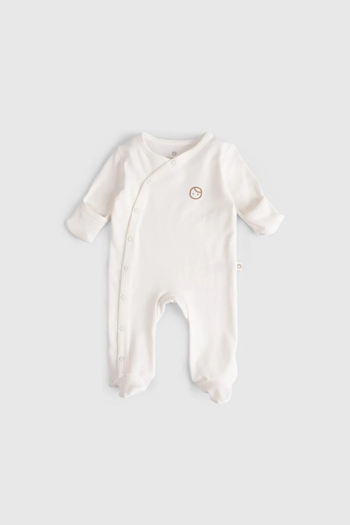 Organic cotton baby sleepsuit in white with snap buttons, soft and comfortable for infants.
