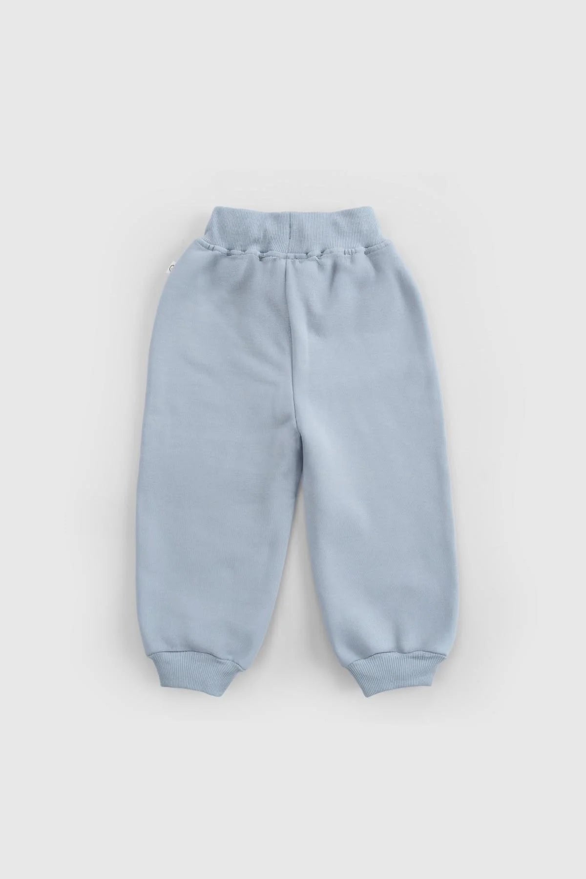 Blue organic cotton baby tracksuit pants with ribbed cuffs for ultimate comfort and style.