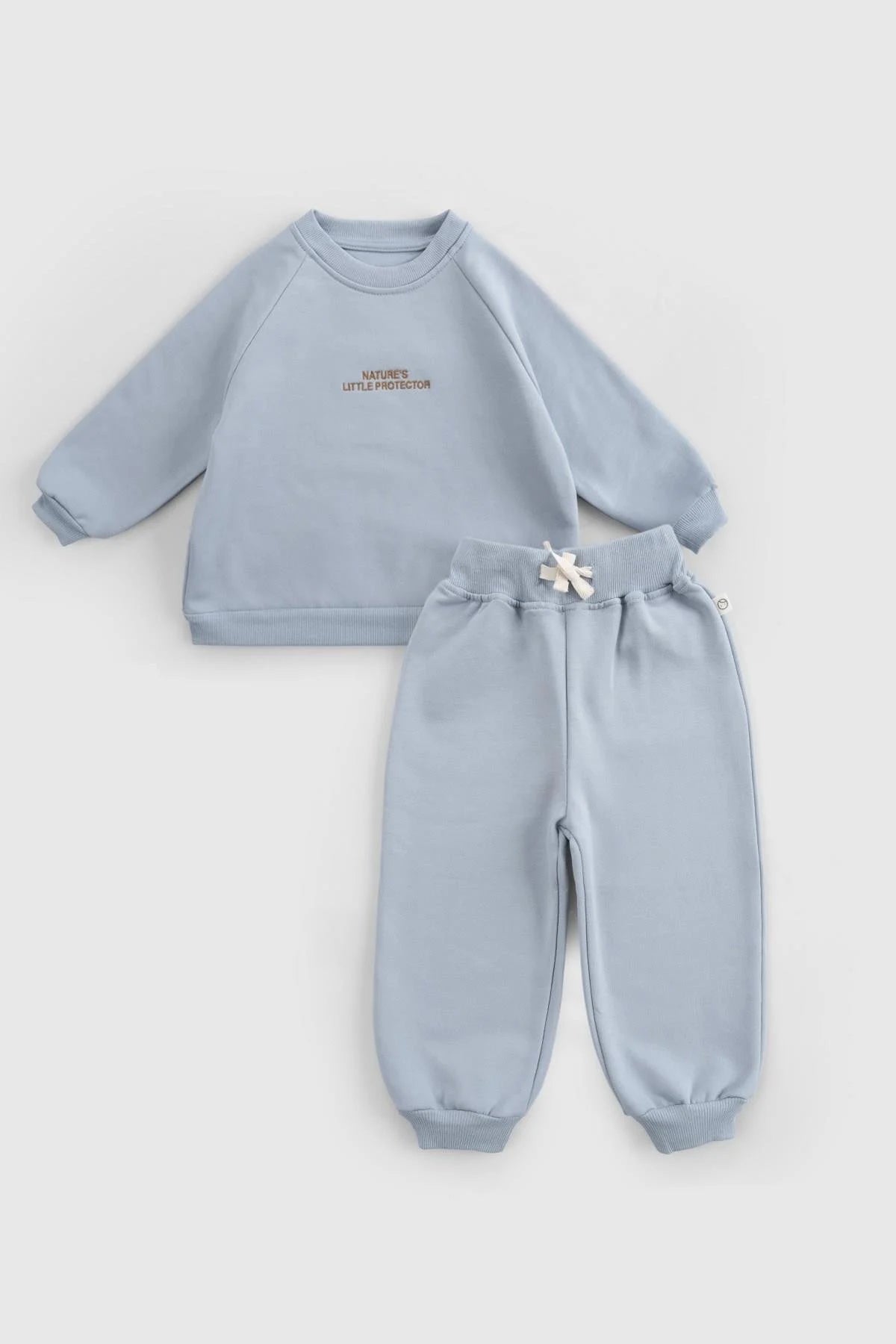 Organic cotton baby tracksuit set in blue, featuring comfortable sweatshirt and pants for stylish winter wear.