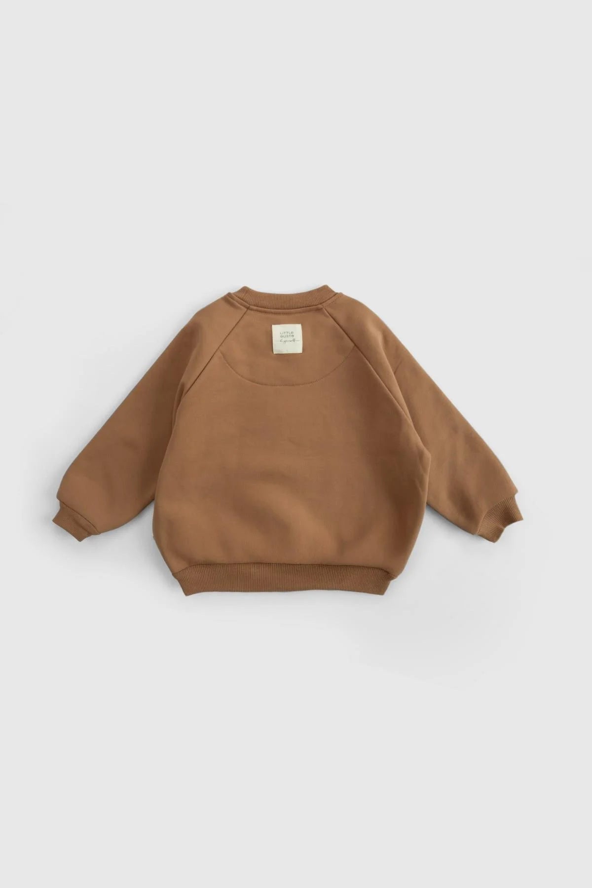 Organic cotton baby tracksuit set in brown, featuring a soft texture and stylish design for comfort and warmth.