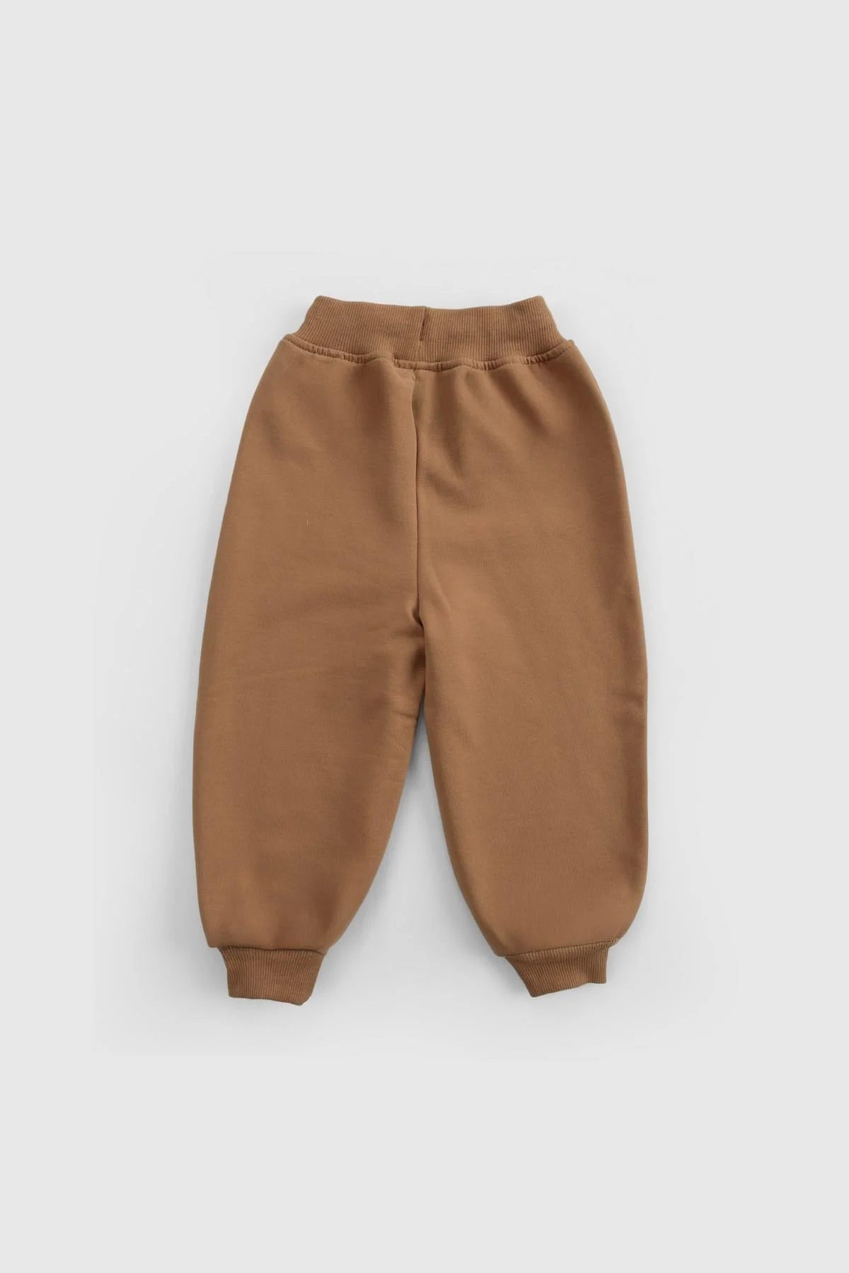 Organic cotton baby tracksuit pants in brown, featuring a comfortable ribbed waistband and cuffs.