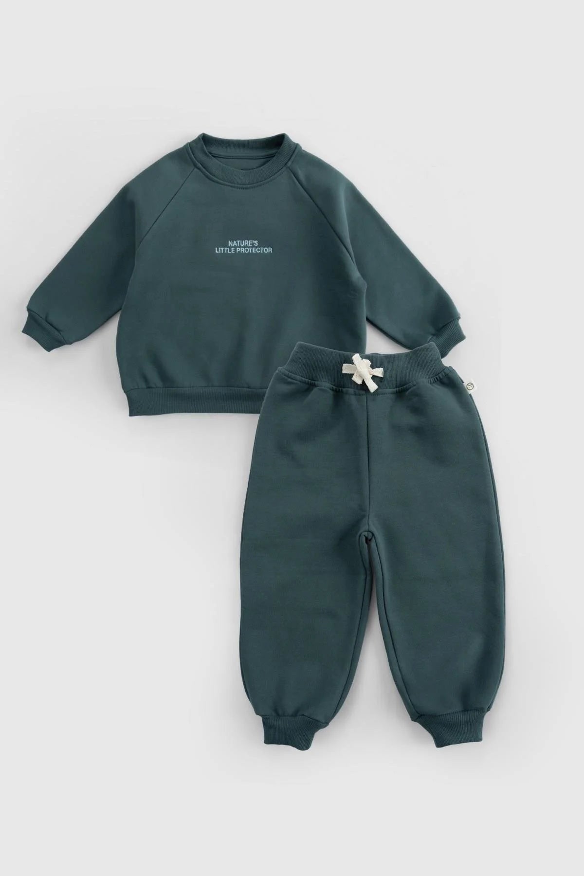 Organic cotton baby tracksuit set in green, featuring a cozy sweatshirt and comfortable pants; stylish and certified quality fabric.