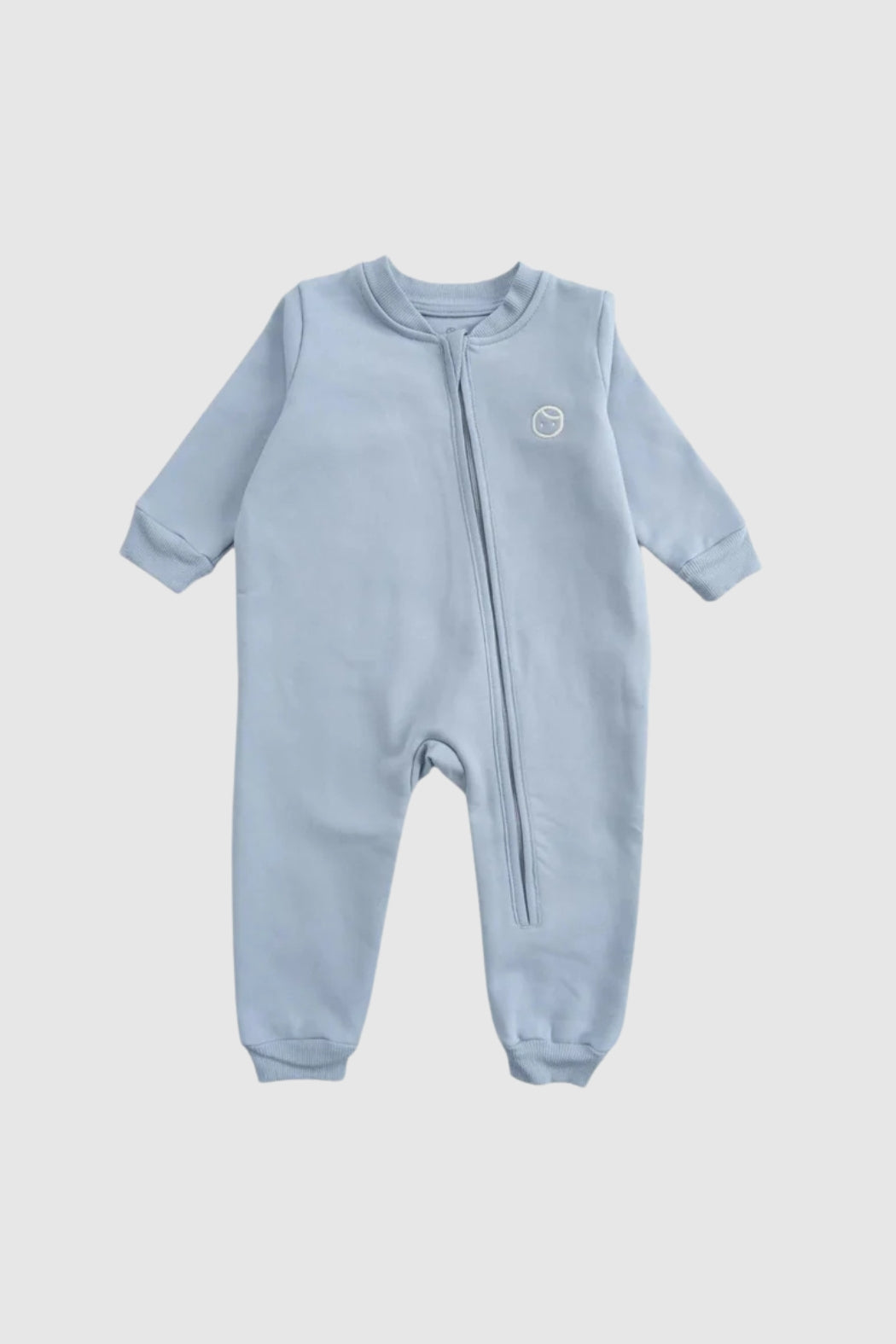 Organic cotton blue zipped onesie for babies, perfect for easy nighttime changes.