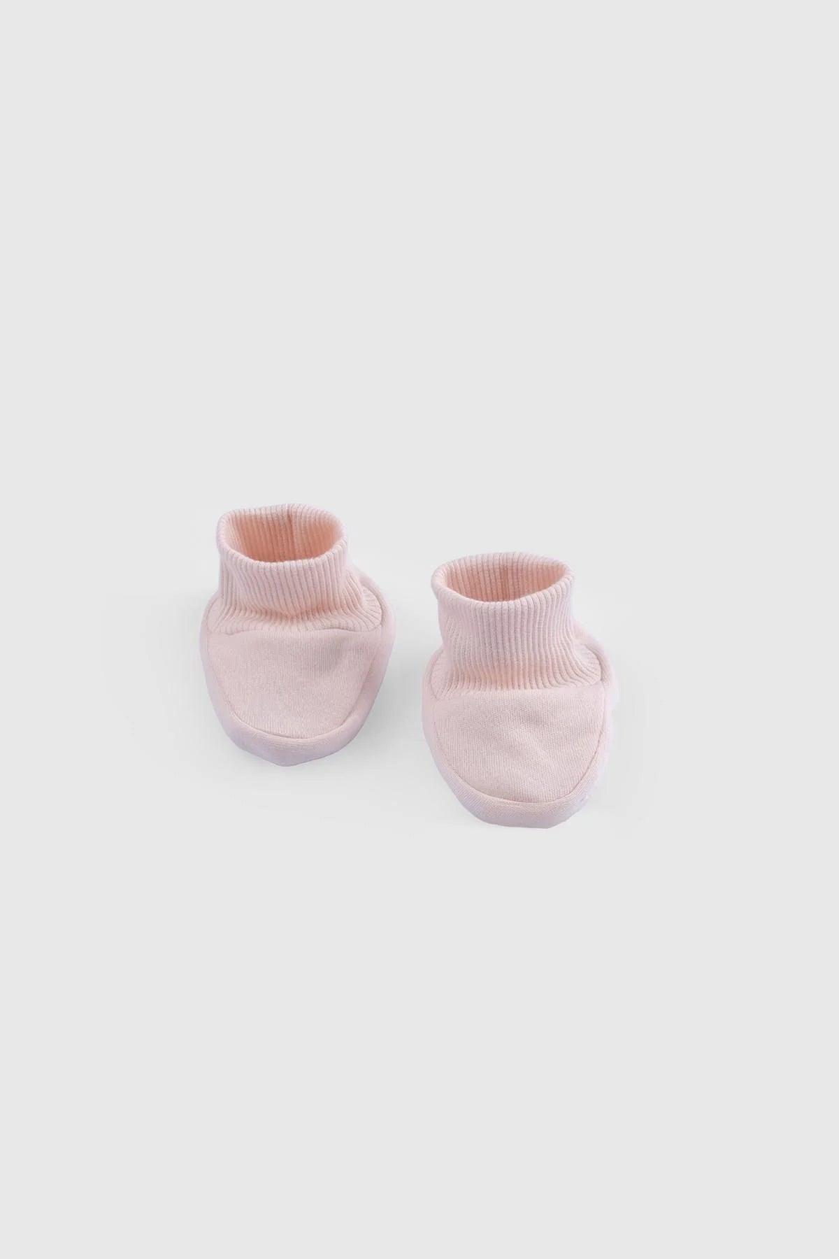 Soft pink organic cotton booties for newborns, perfect for delicate skin and part of a 10-piece baby set.