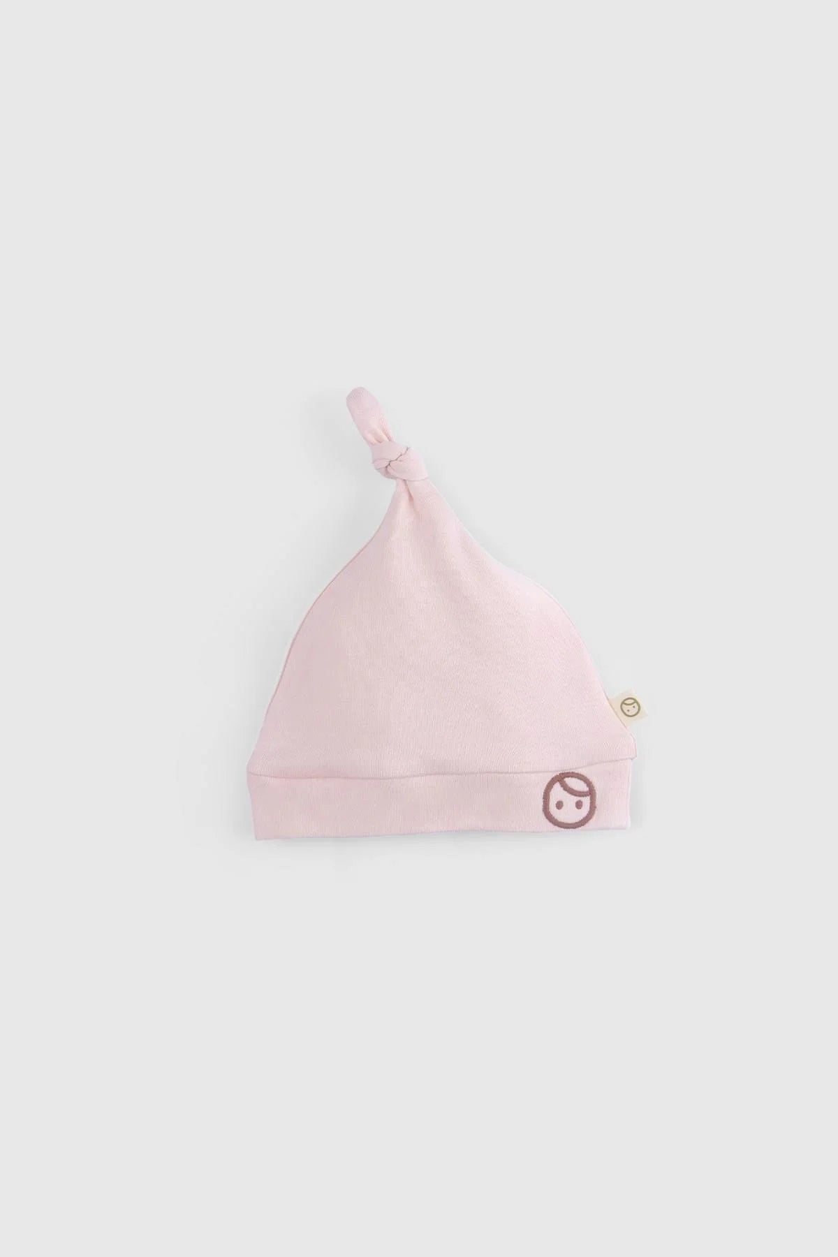 Organic cotton newborn pink hat with knot, soft and breathable, part of the Little Gusto 10-piece set.