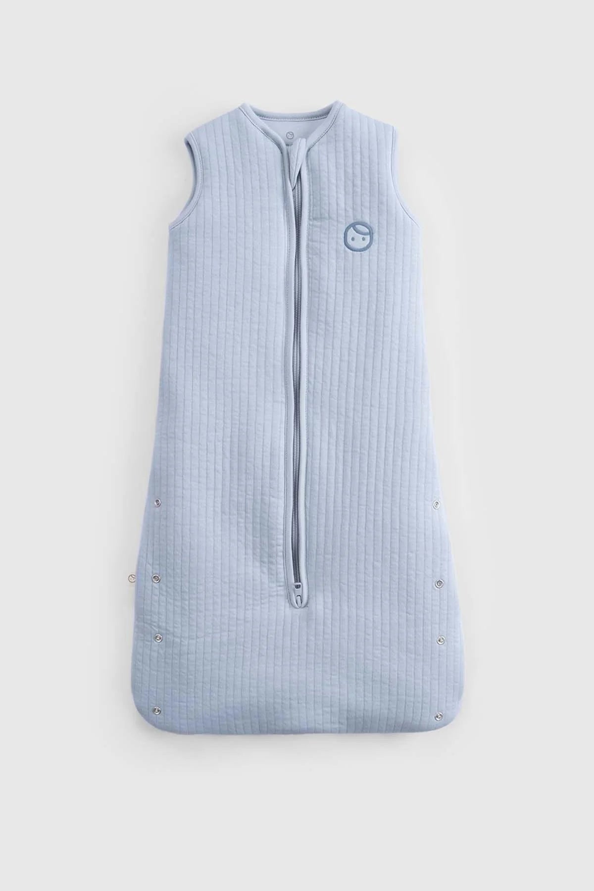 Blue organic cotton quilted sleeping bag for babies, featuring a sleeveless design and zipper closure.