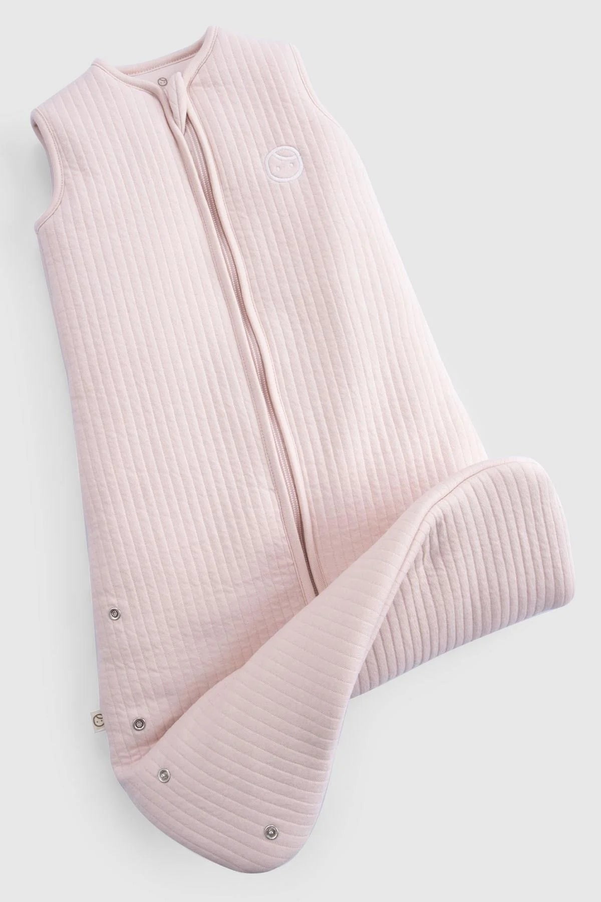 Organic cotton quilted sleeping bag in pink, designed for baby comfort and safety during sleep.