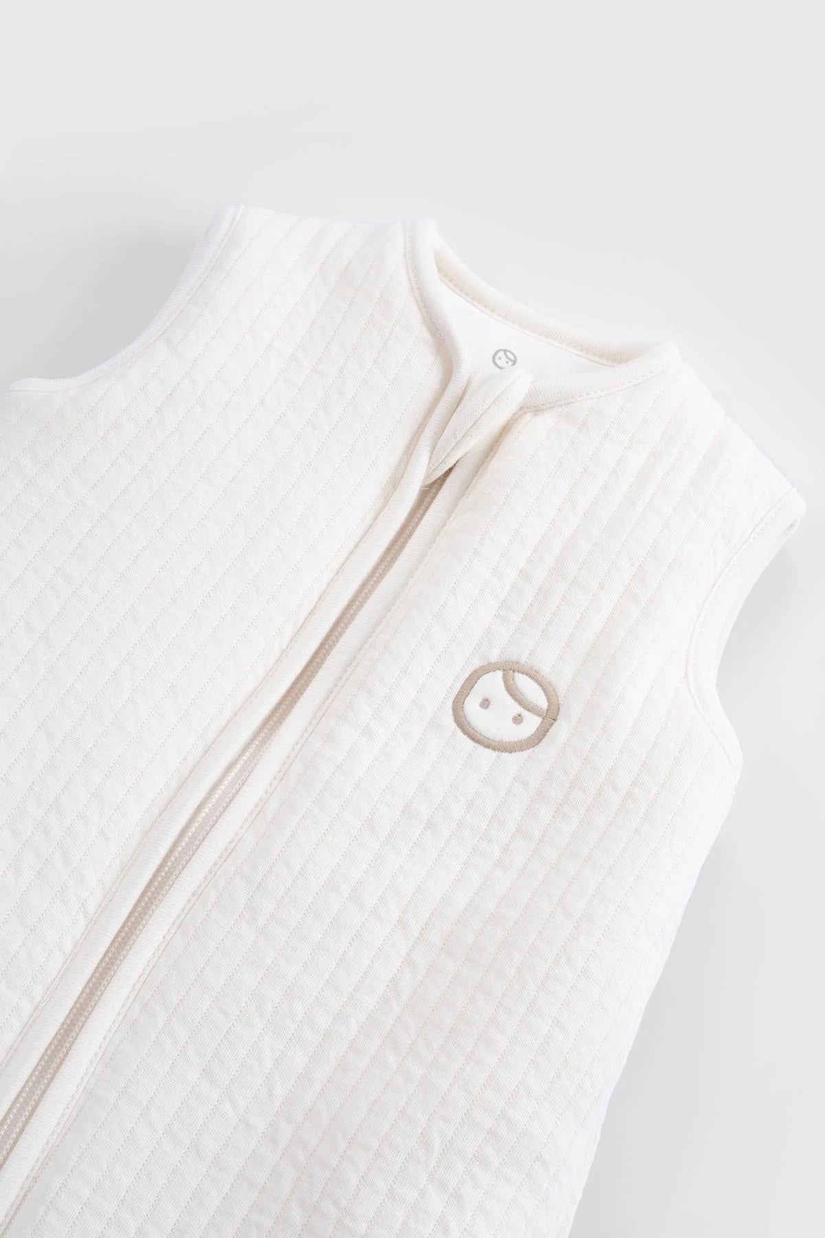 Little Gusto Organic Cotton Quilted Sleeping Bag in white, featuring a sleeveless design and soft quilted texture.