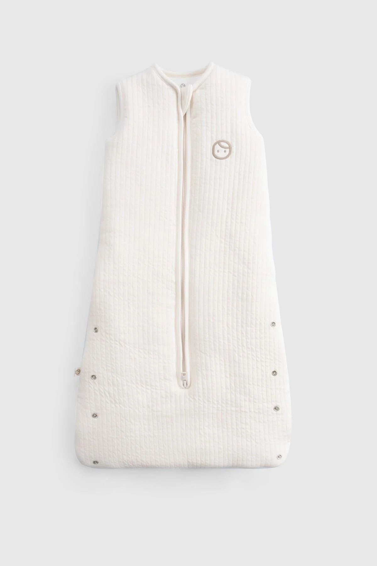 Organic cotton quilted sleeping bag in white, designed for baby's comfort and safety with a sleeveless design.