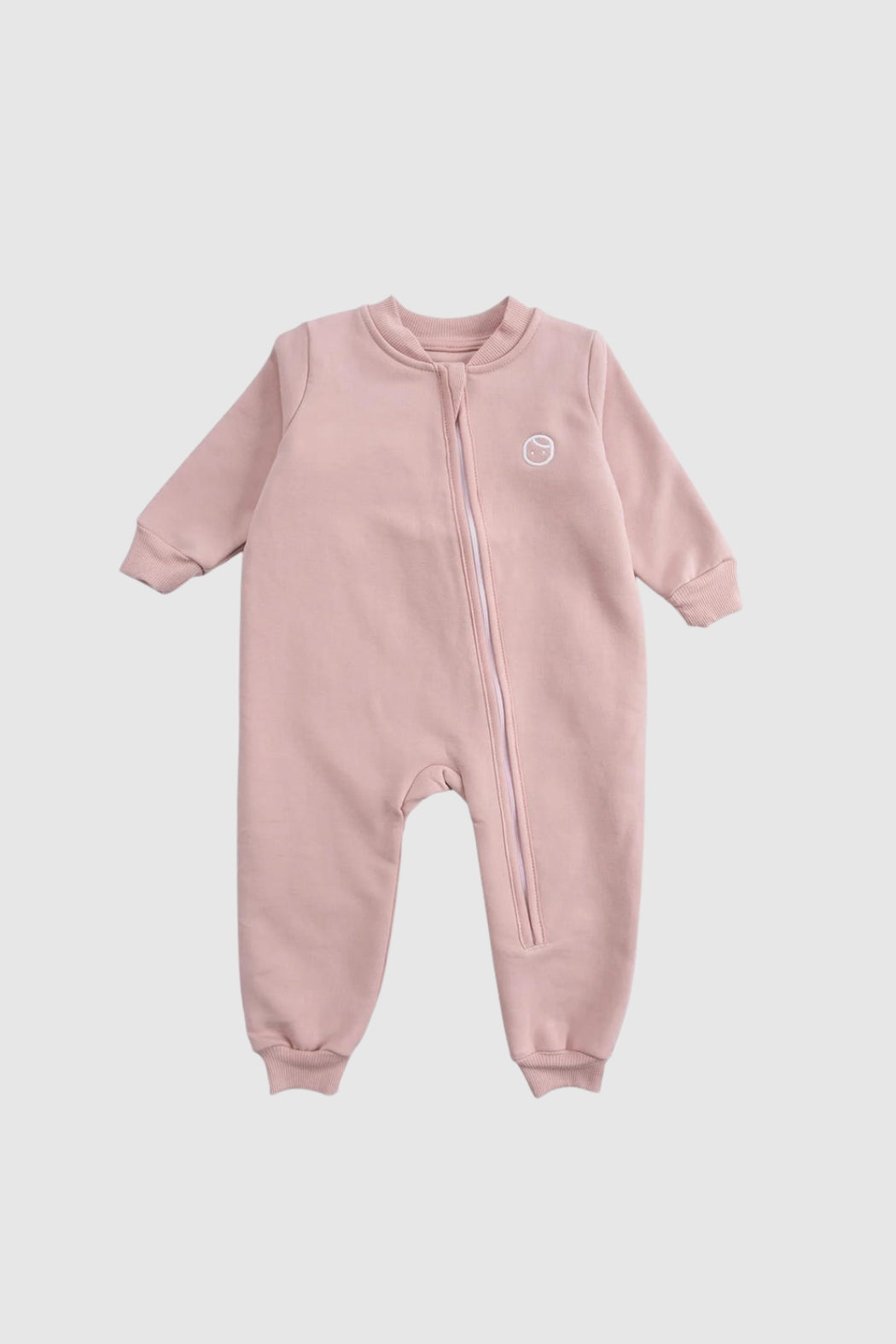Organic cotton zipped onesie in pink color, featuring built-in mittens and booties for babies.