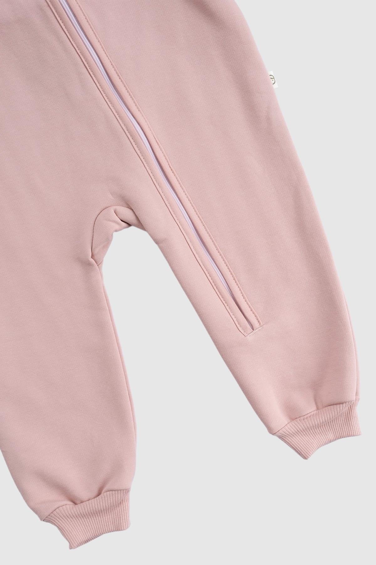 Organic cotton zipped onesie in pink, featuring quilted texture, footed design, and comfortable mittens.