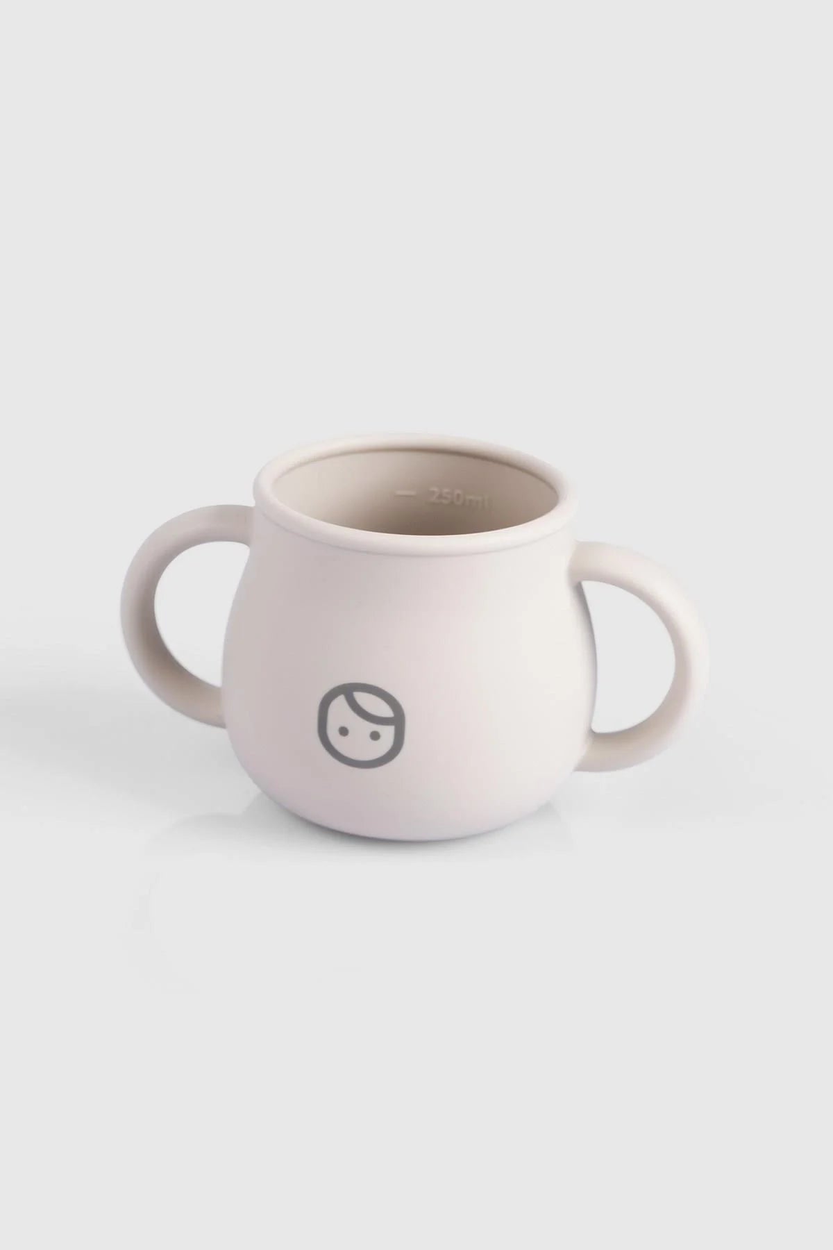 Beige silicone snack cup for babies with two handles and playful face design, ideal for hydration and snacks.