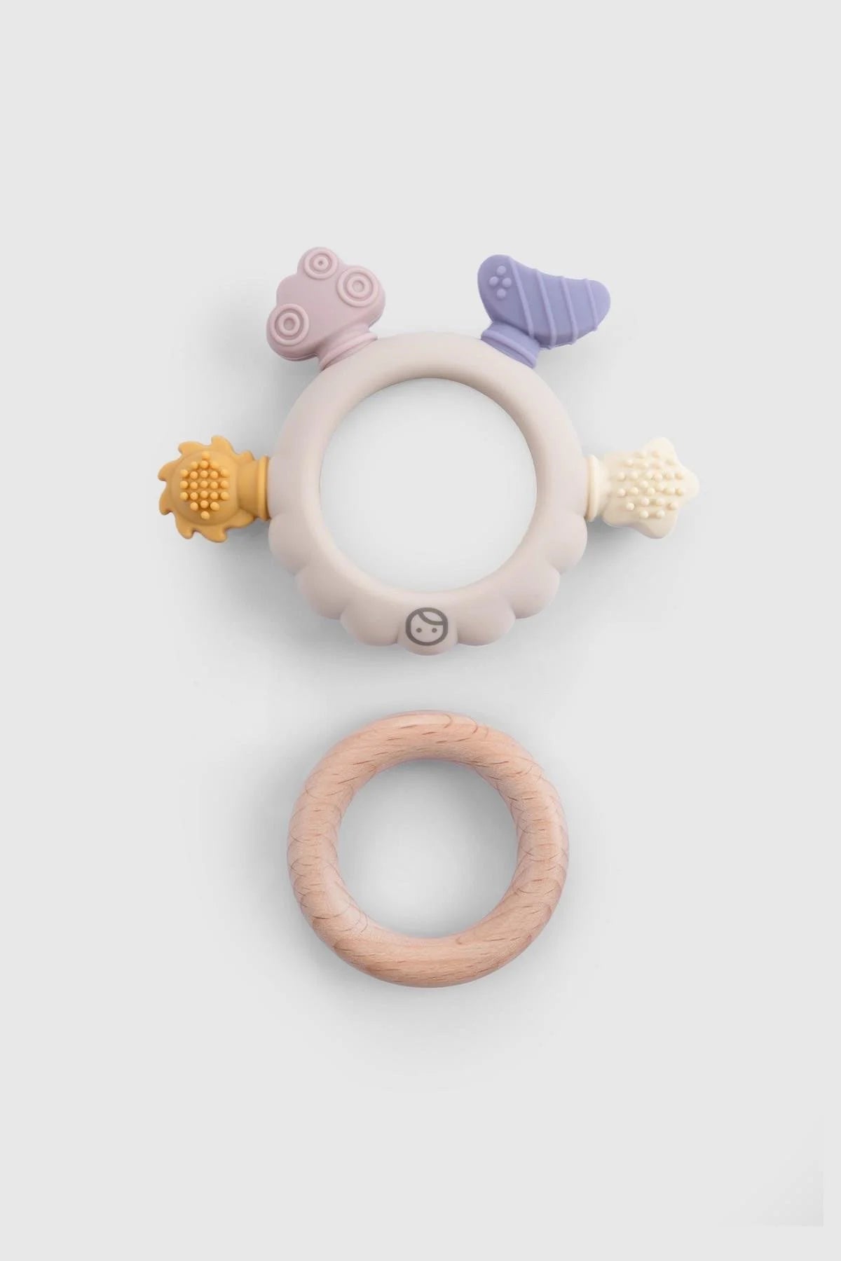 Little Gusto silicone and wooden teether, featuring colorful textures for sensory exploration and grasping skills.