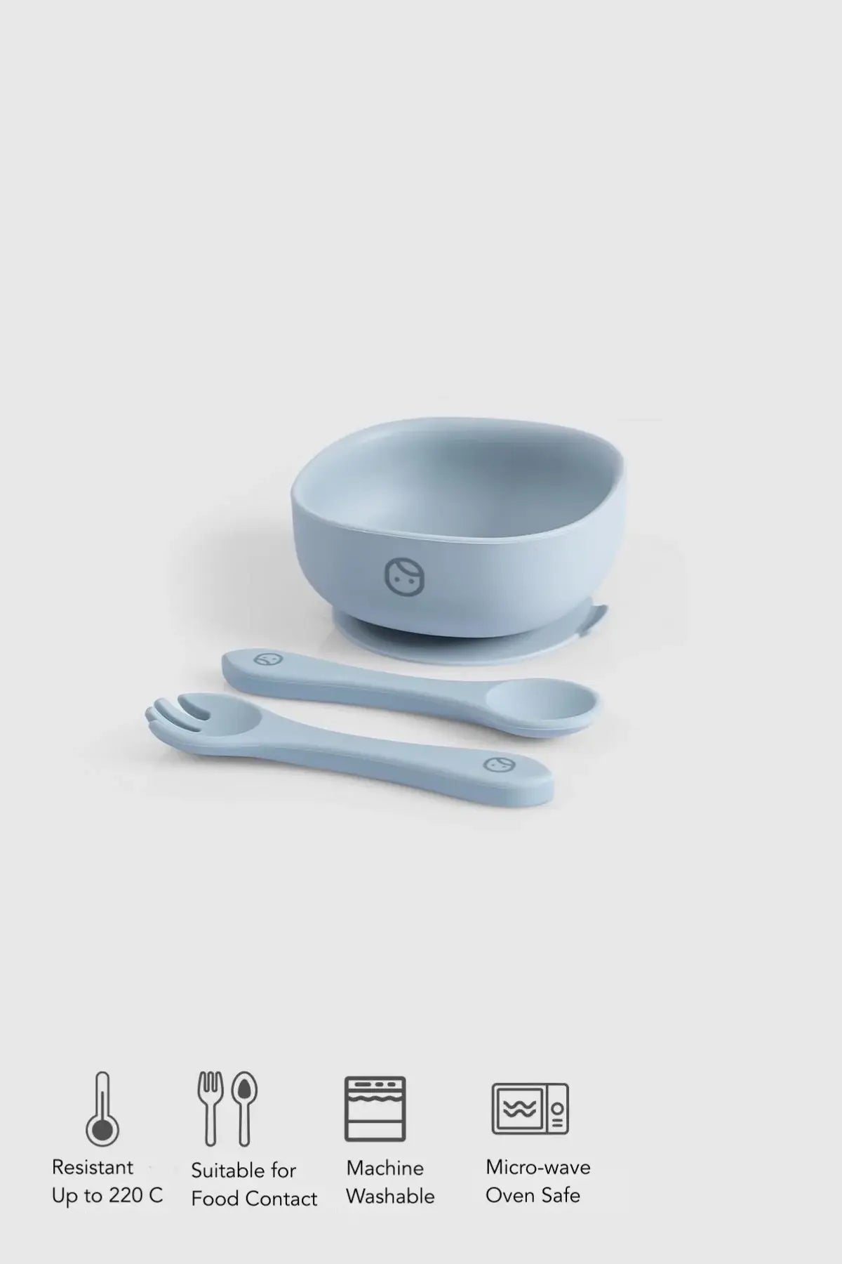 Silicone vacuum food plate and cutlery set in blue, featuring bowl, fork, and spoon, designed for easy self-feeding.