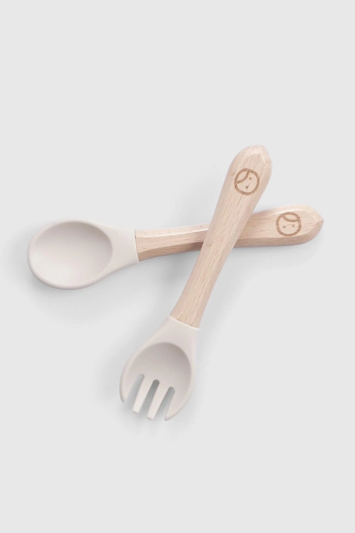 Baby cutlery set with bamboo handles, BPA-free silicone spoon and fork for newborn self-feeding.