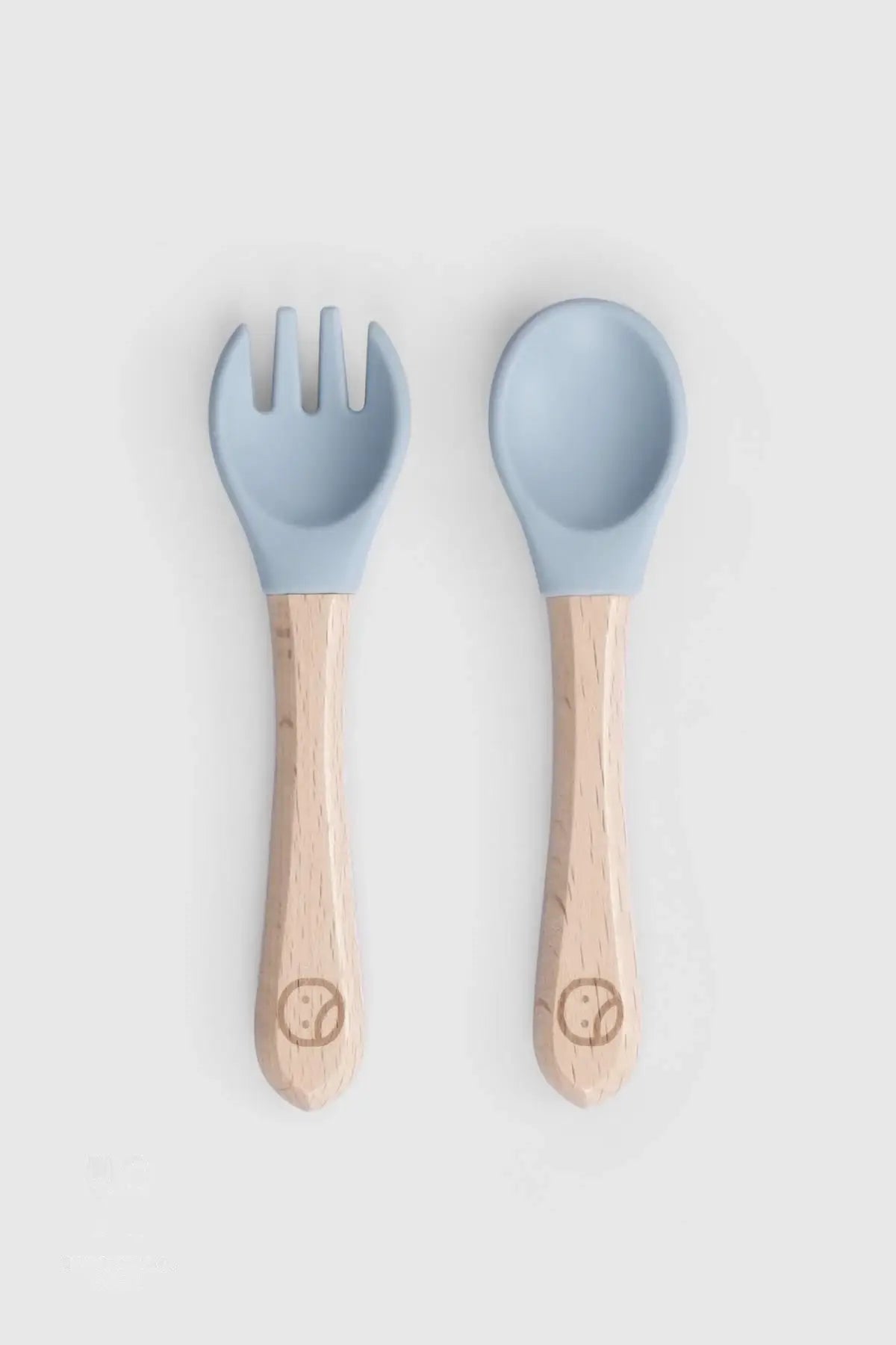 Baby cutlery set with bamboo handles in blue, featuring silicone tips for safe newborn feeding, Montessori-inspired design.