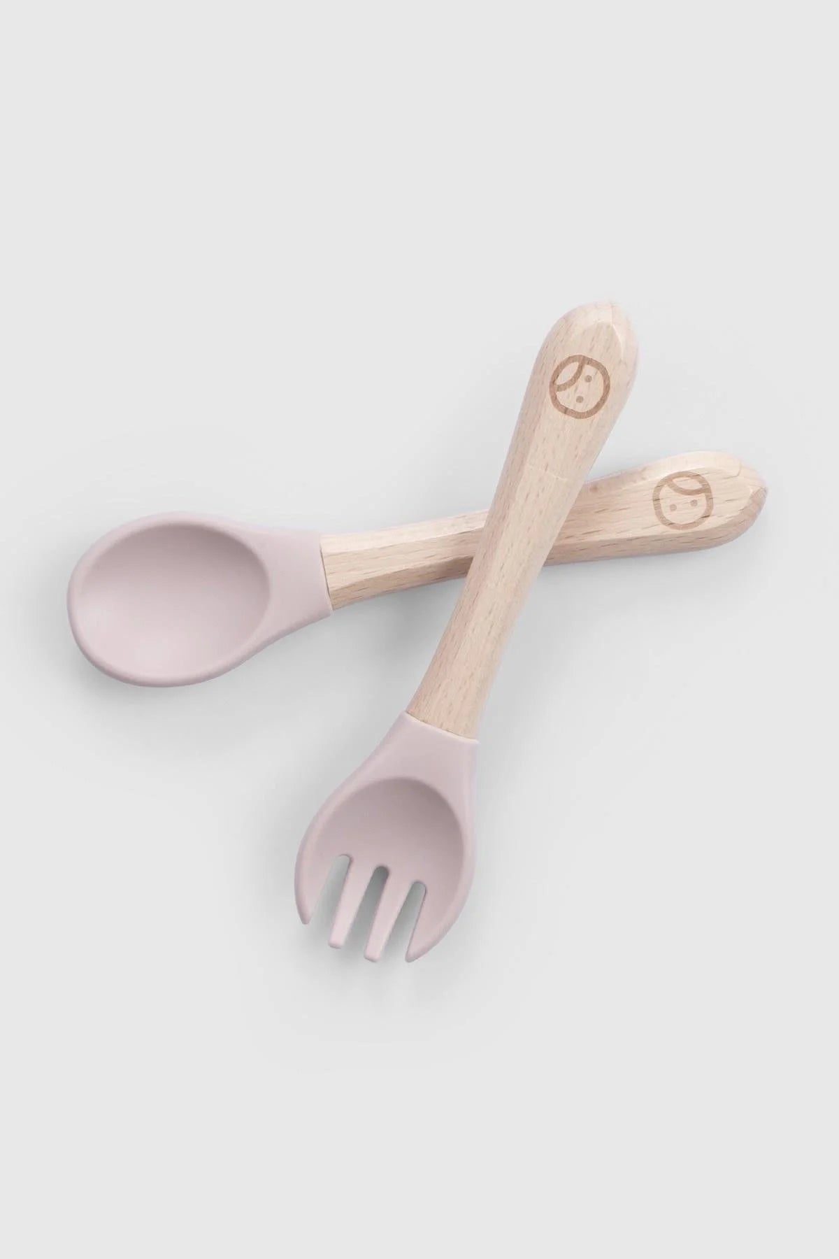 Baby silicone cutlery set with bamboo handles in pink, perfect for newborn feeding, BPA-free, Montessori-inspired design.