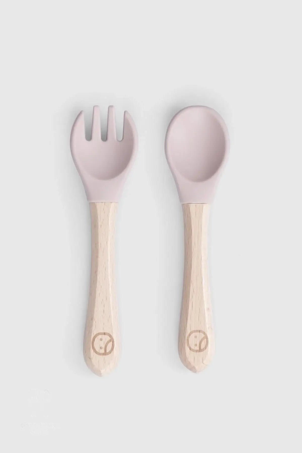 Baby cutlery set with bamboo handles in pink, featuring silicone spoon and fork, perfect for newborn feeding.