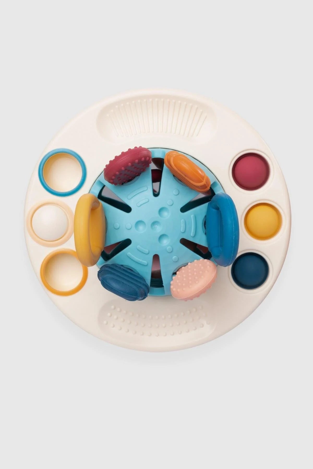 Colorful silicone educational UFO toy for toddlers, designed for visual perception and hand-eye coordination.
