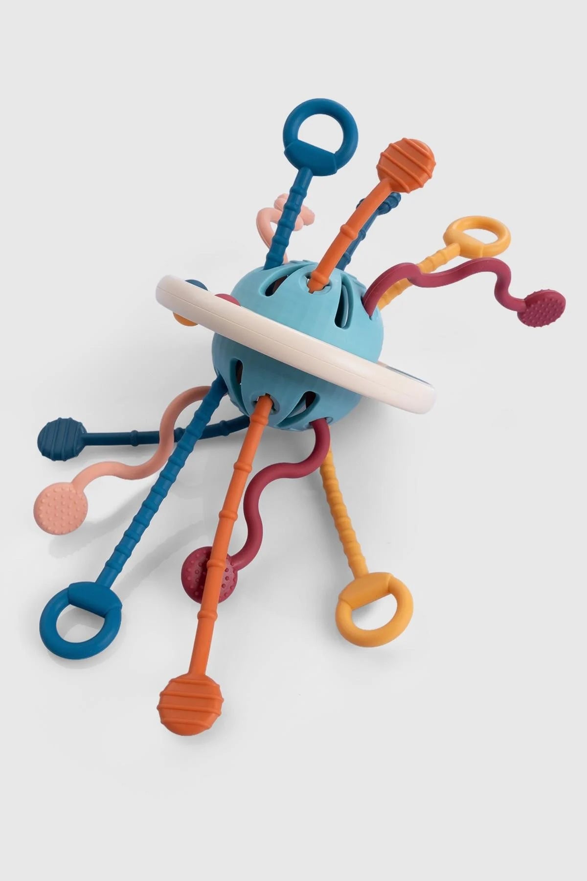 Colorful silicone UFO toy for toddlers, designed to enhance hand-eye coordination and visual stimulation.