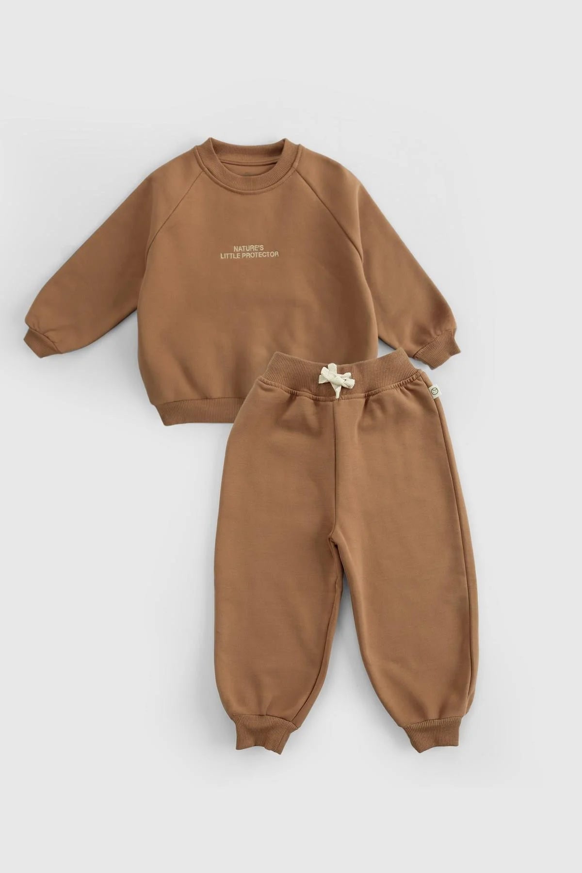 Organic cotton baby tracksuit set in brown, featuring stylish design and quality fabric for comfort and warmth.