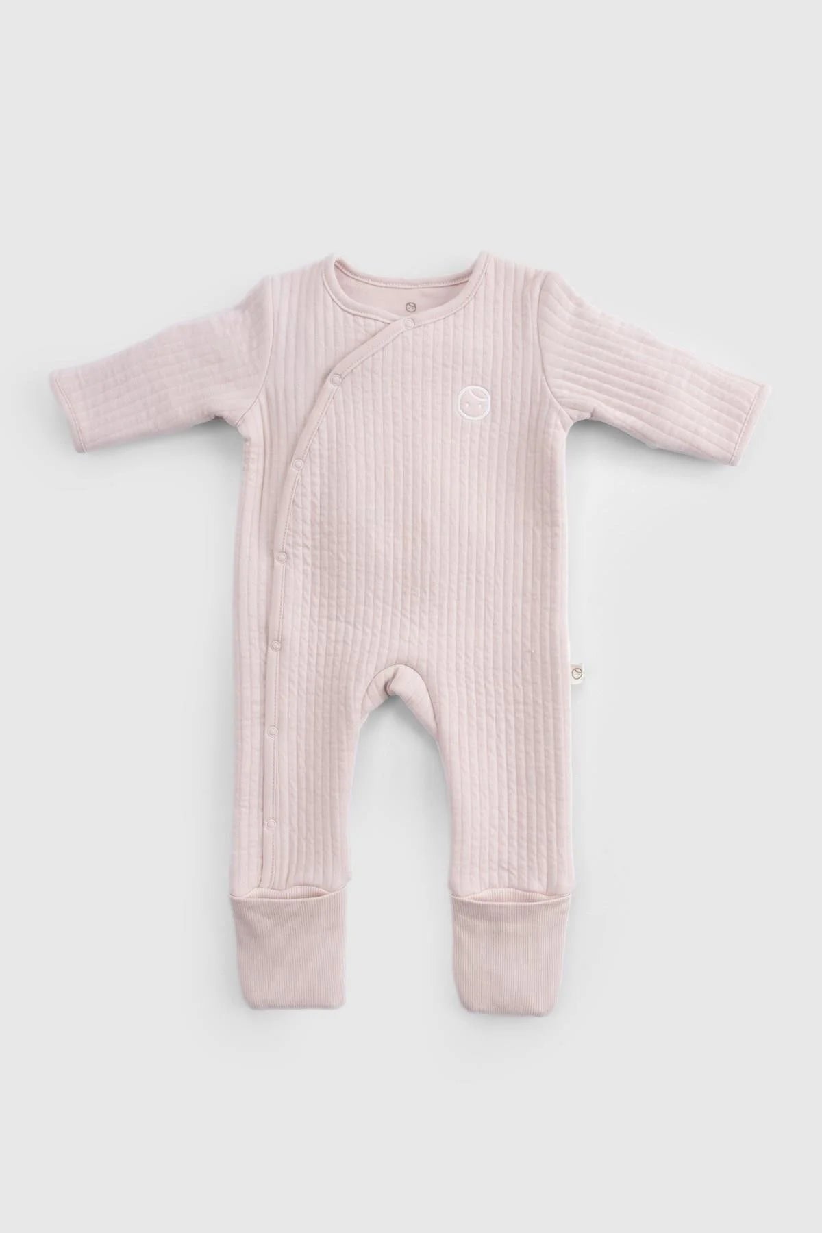 Organic cotton quilted sleepsuit in pink, designed for comfort and warmth for babies during cooler nights.