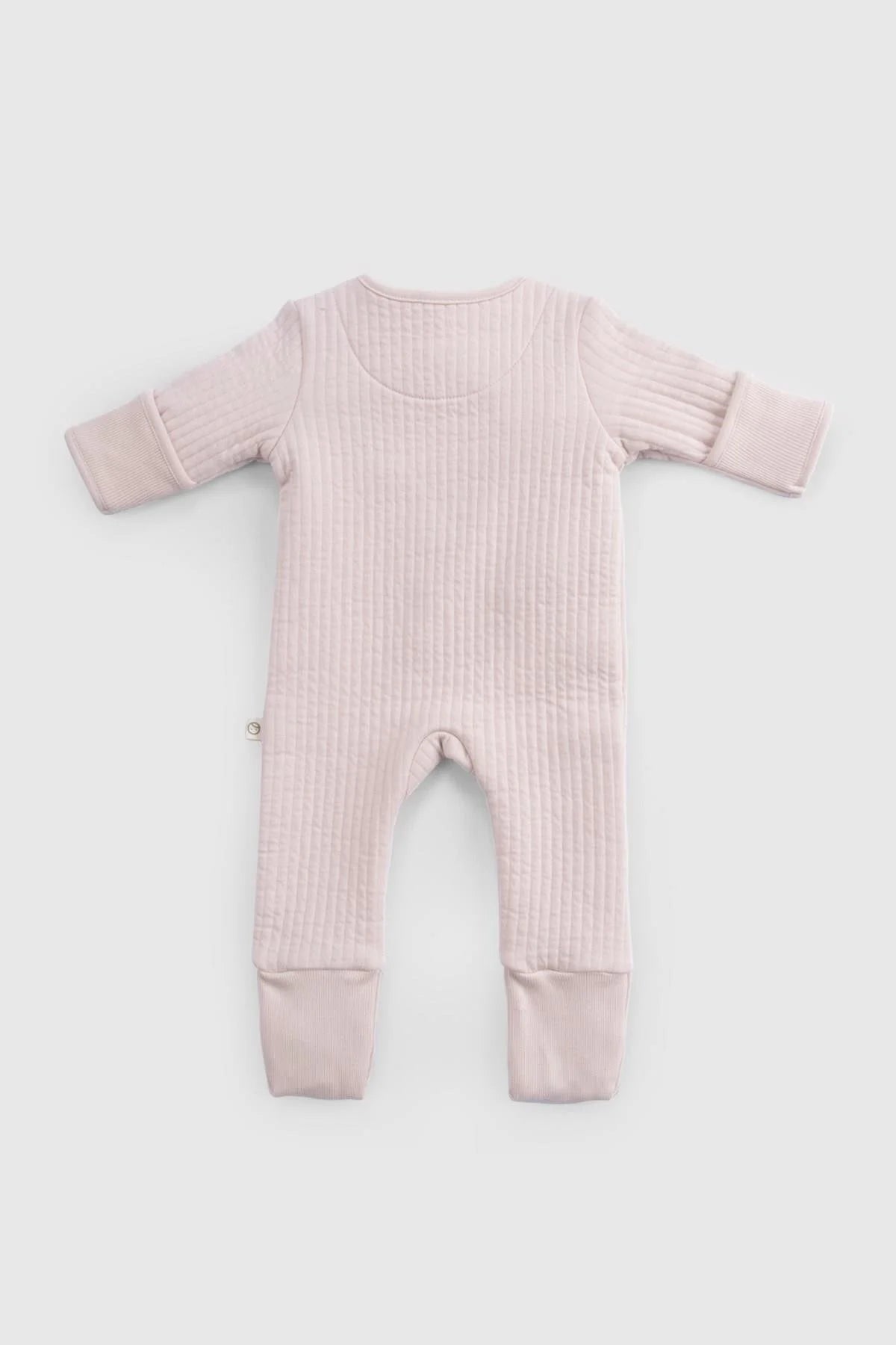 Back view of pink organic cotton quilted sleepsuit for babies, featuring long sleeves and cozy padded design.