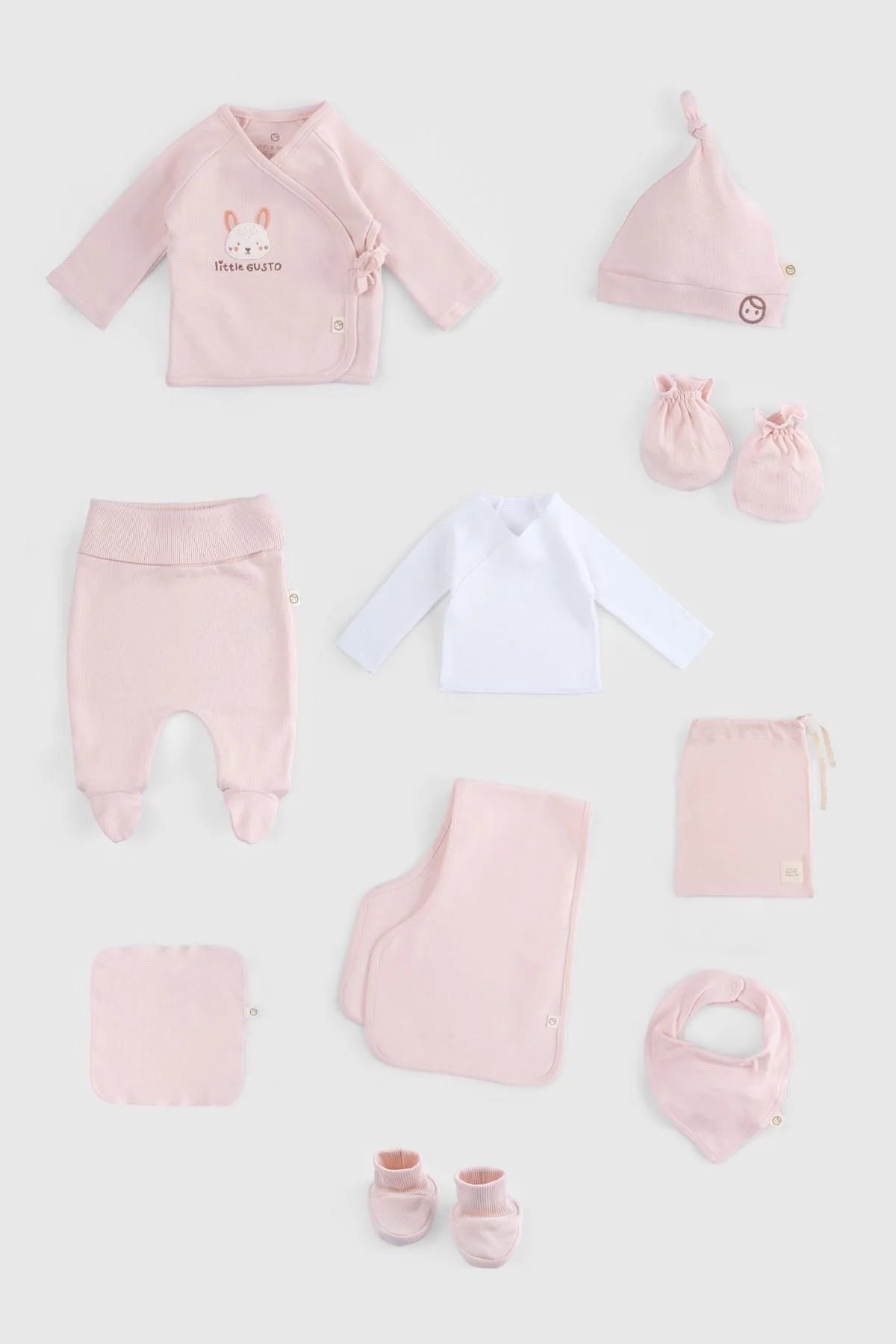 Organic cotton newborn set in pink, 10 pieces including bodysuit, hat, trousers, booties, and bib.