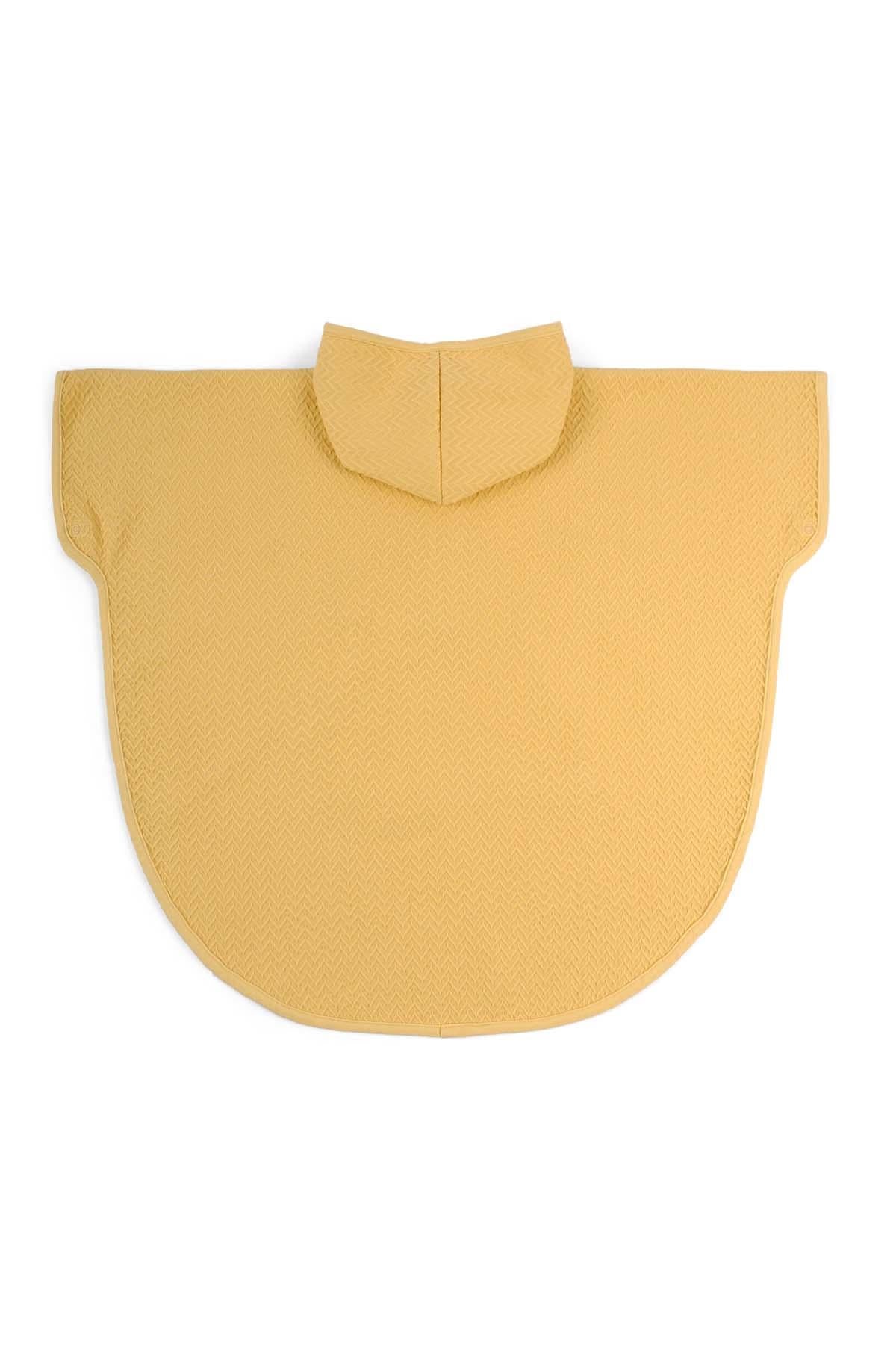 Yellow organic cotton jacquard poncho designed for comfort and absorbency