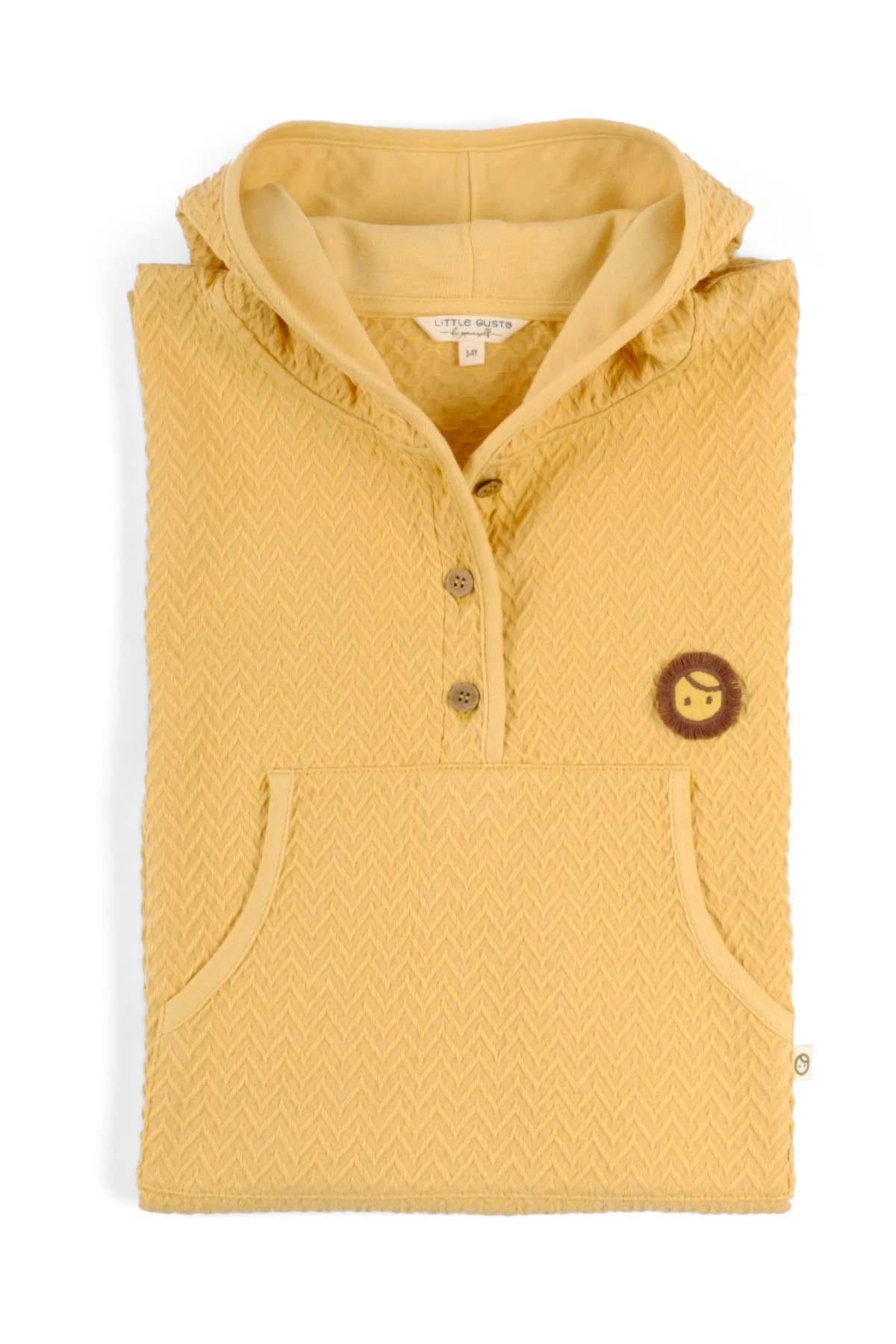 Yellow organic cotton jacquard poncho designed for comfort and absorbency