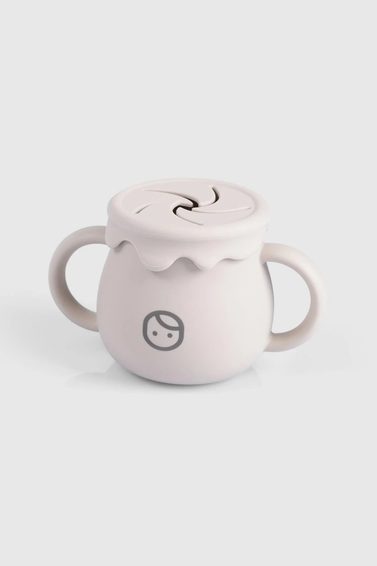 Beige silicone snack cup for babies with a straw lid and easy-grip handles, designed for mess-free snacking.