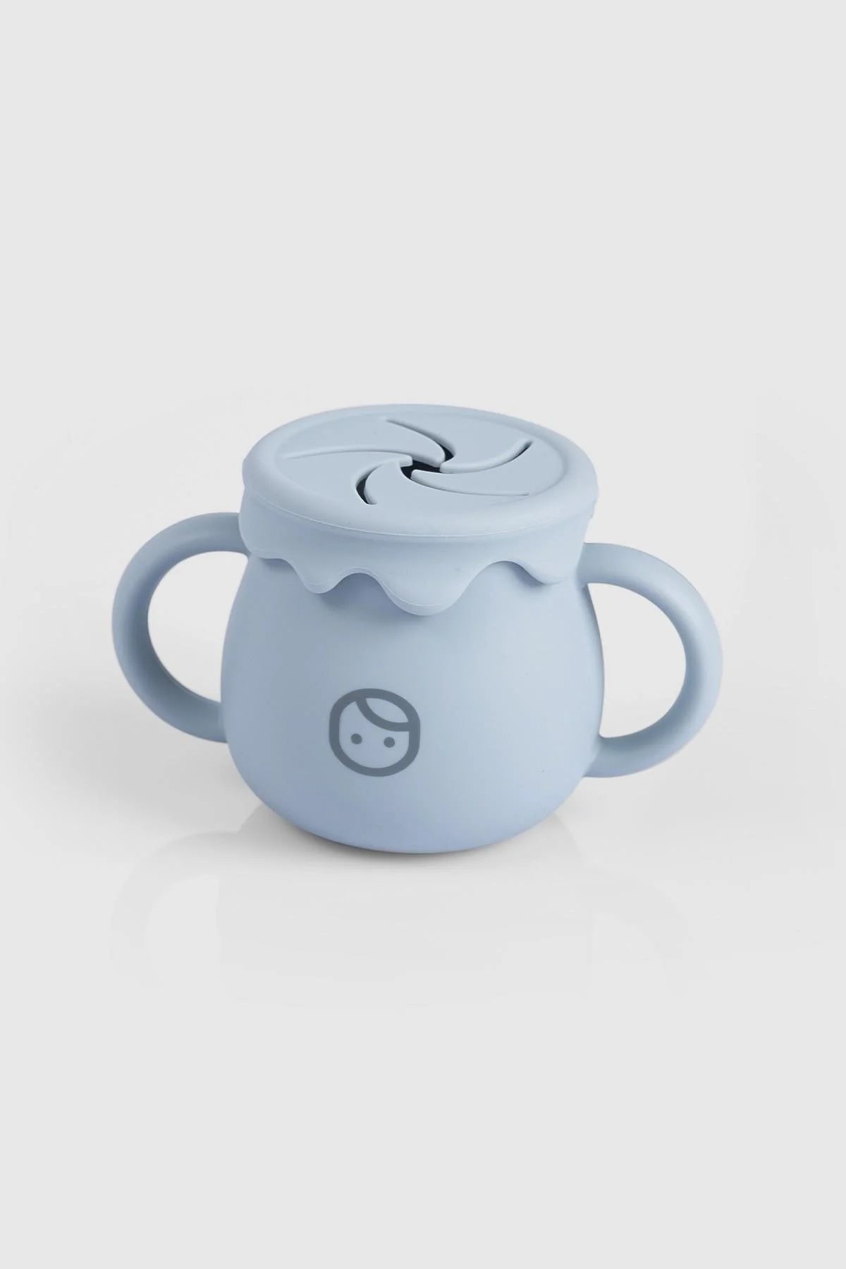 Blue silicone snack cup with straw lid for toddlers, BPA-free and Montessori-inspired design for easy feeding.